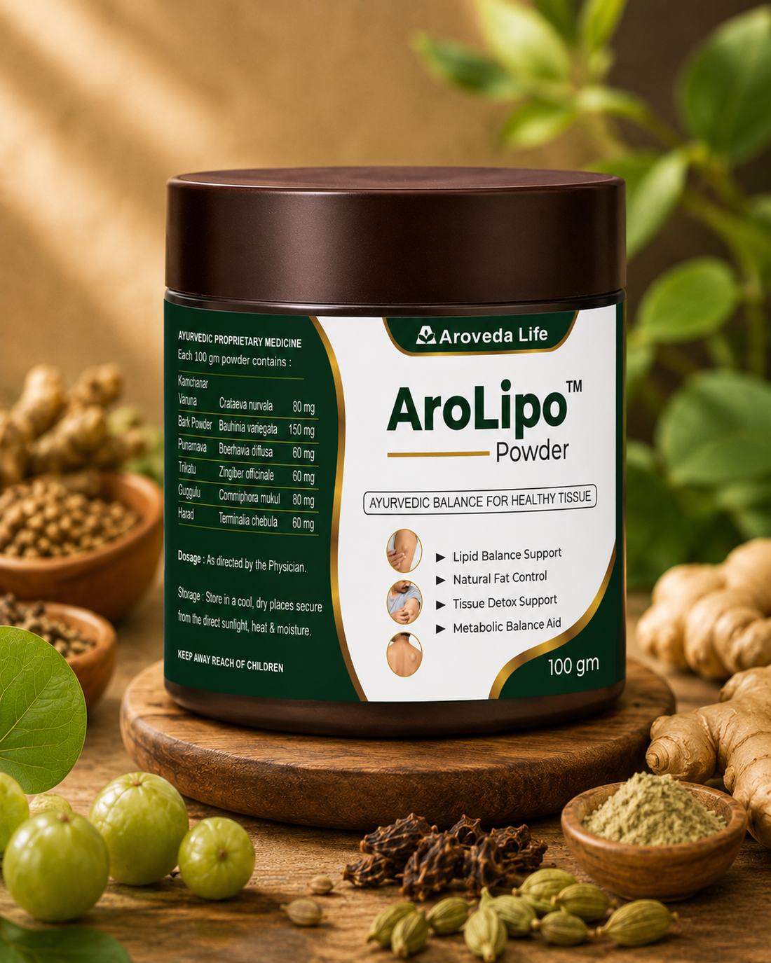 A jar of Aroveda Life AroLipo Powder sits on a wooden stand surrounded by natural ingredients like green amla fruits, ginger root, cardamom pods, and spices on a rustic wooden table with a warm, blurred background.