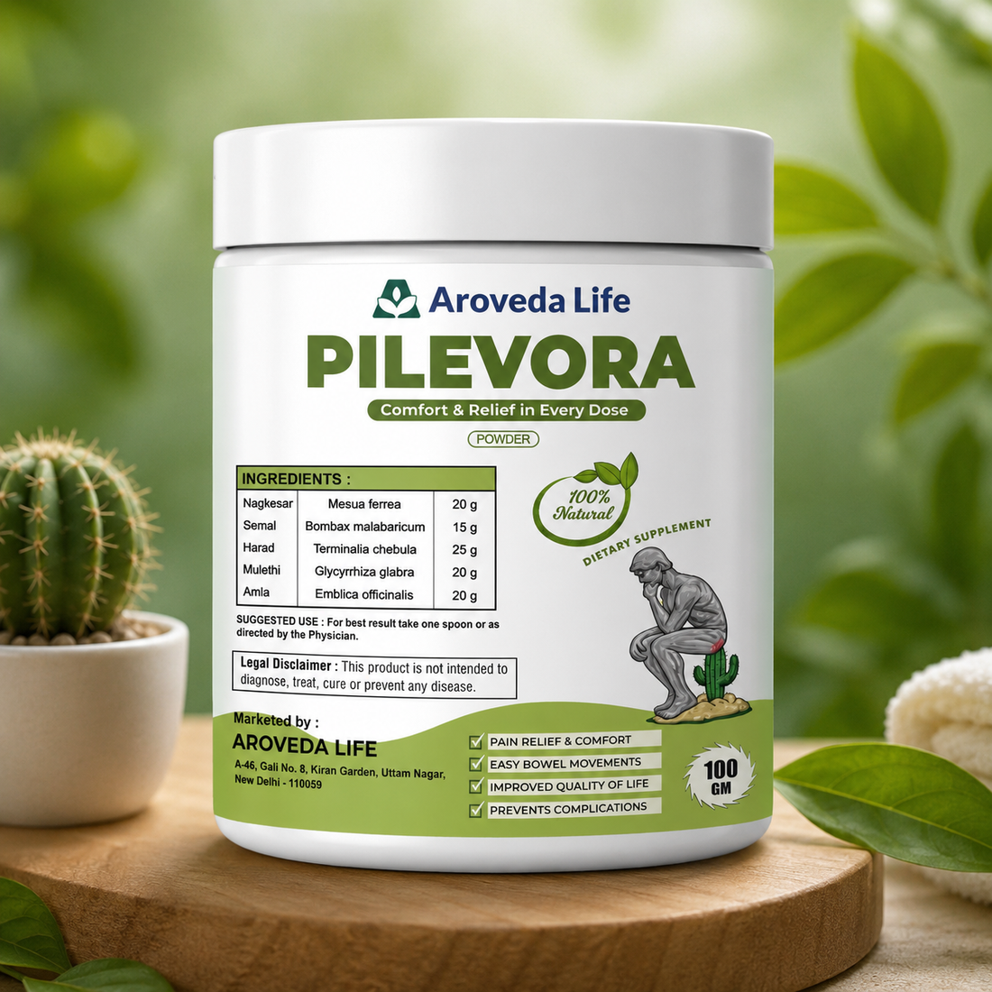Aroveda Life Pilevora supplement container on a wooden surface with greenery in the background