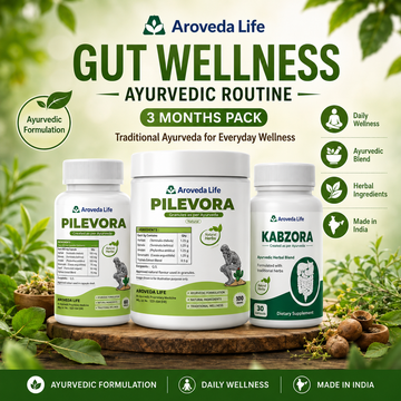 Three Aroveda Life Ayurvedic supplement bottles displayed on a wooden tray with green leaves and herbs around them. The products are Pilevora, Kabzora, and an unnamed gut wellness routine pack.